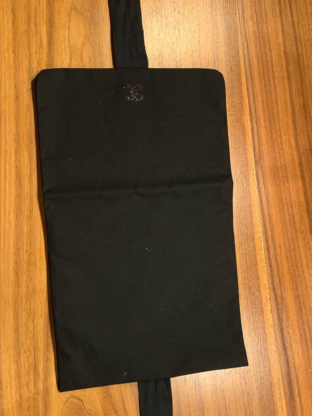 Authentic  black Chanel rare pouch with CC sparky logo with closing strops.Must!